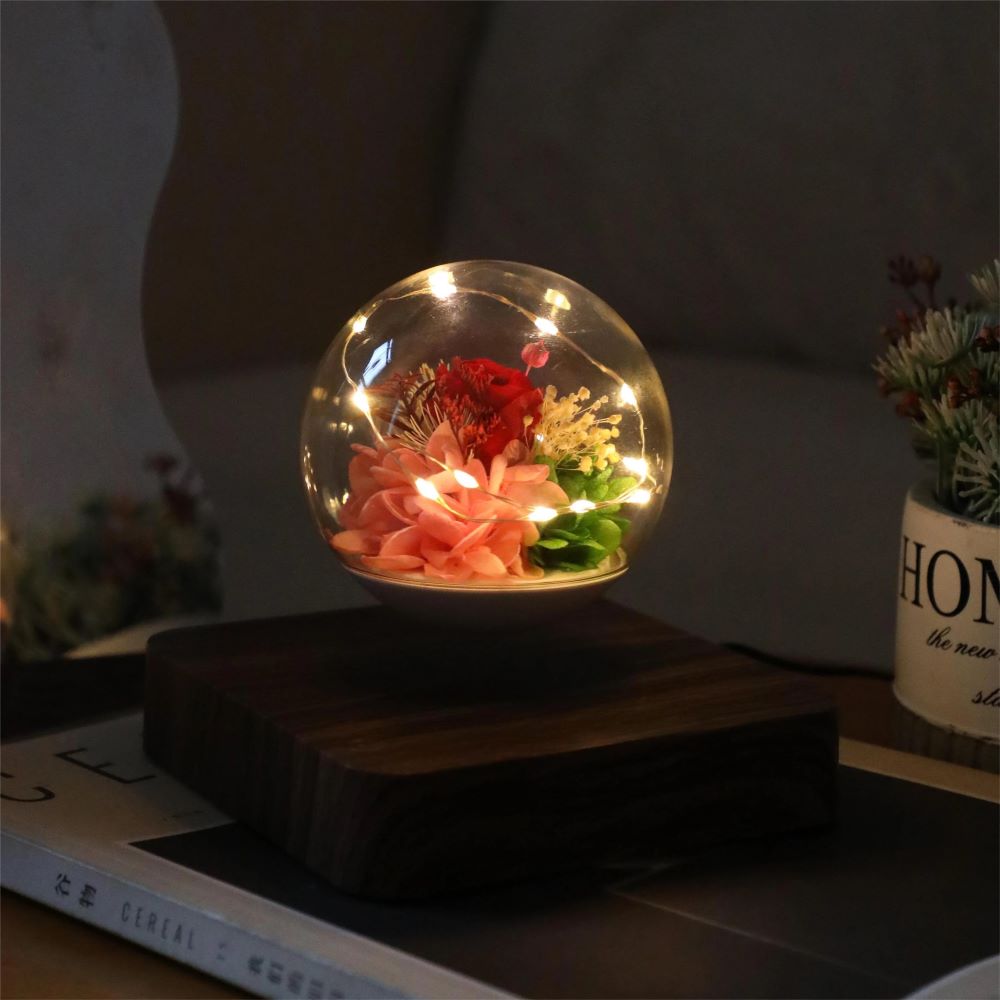 LEV Rose Bulb levitating rose lamp on bedside table